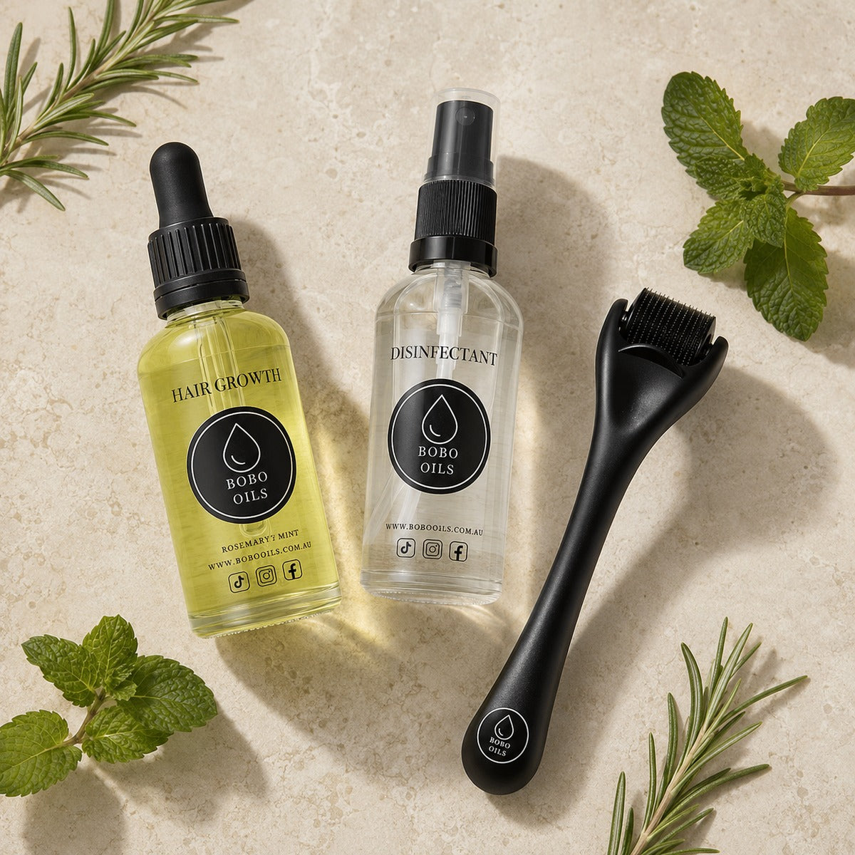 BOBO OILS Rosemary and Mint Hair Growth Oil bottle and BOBO OILS Scalp Derma Roller and Disinfectant Spray