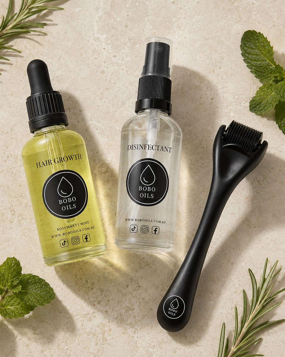 BOBO OILS Rosemary and Mint Hair Growth Oil bottle and BOBO OILS Scalp Derma Roller and Disinfectant Spray