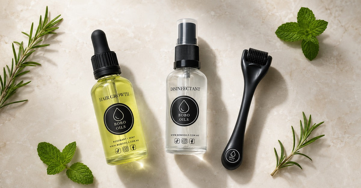 BOBO OILS Rosemary and Mint Hair Growth Oil bottle and BOBO OILS Scalp Derma Roller and Disinfectant Spray