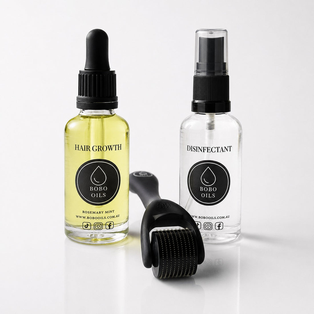 BOBO OILS Rosemary and Mint Hair Growth Oil bottle and BOBO OILS Scalp Derma Roller and Disinfectant Spray