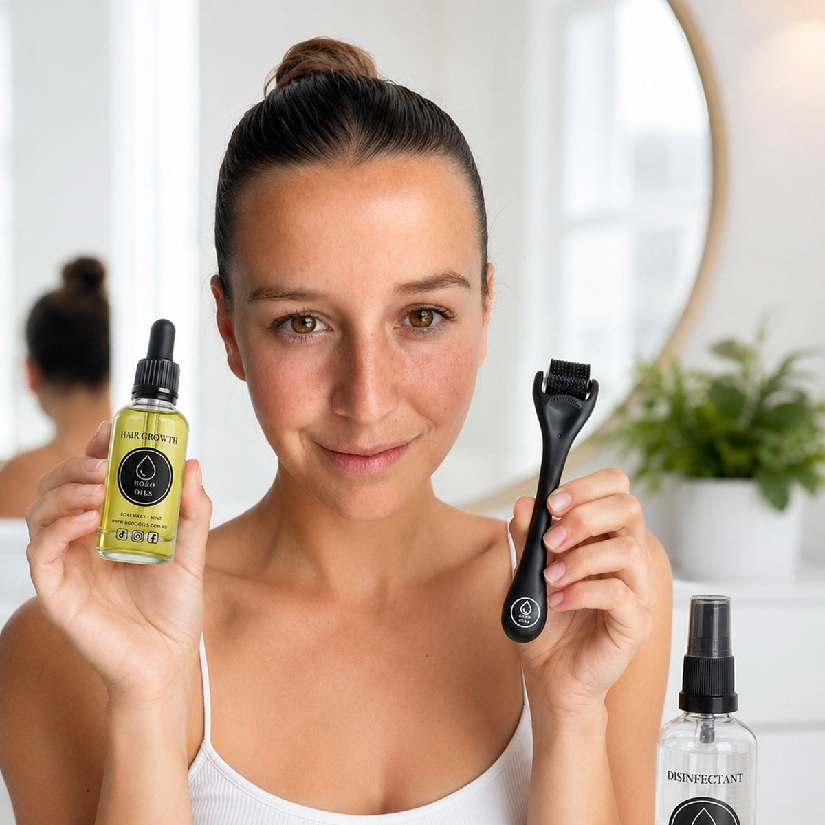 BOBO OILS Rosemary and Mint Hair Growth Oil bottle and BOBO OILS Scalp Derma Roller and Disinfectant Spray