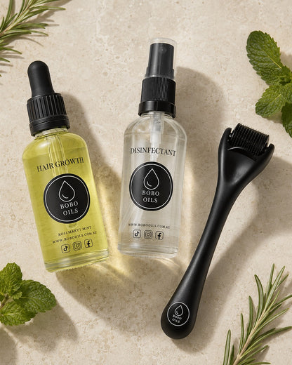 BOBO OILS Rosemary and Mint Hair Growth Oil bottle and BOBO OILS Scalp Derma Roller and Disinfectant Spray
